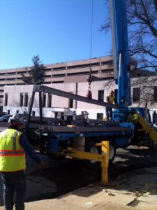 Steel being erected with a boom truck